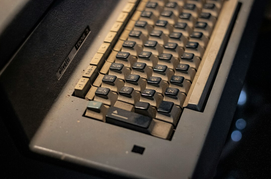 Laptop with programming code on screen on a desk